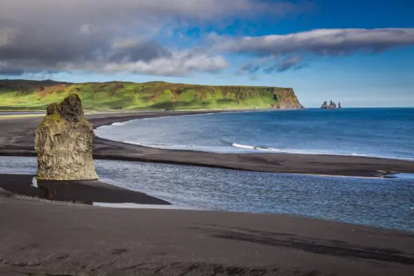 9-day self-drive tour around Iceland, big rock on the black beach.