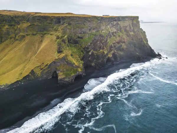9-day self-drive tour around Iceland, cliffs on Reynisfjara black beach.