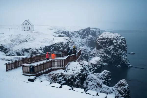 10-Day Winter Ring Road Tour Around Iceland, tourist platform close to the sea.