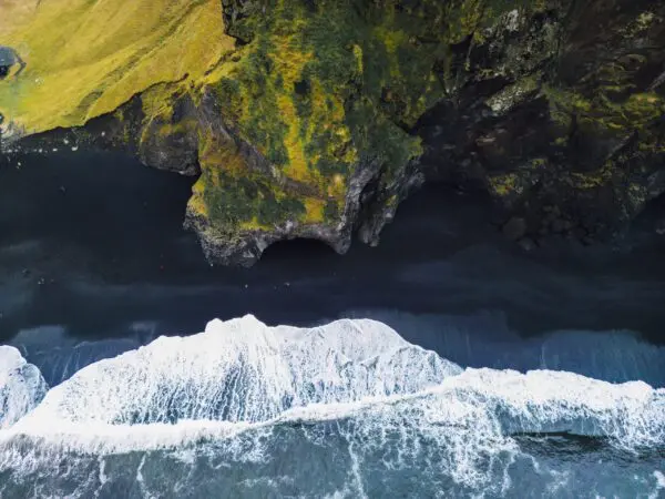 8-Day Highland Road & Hiking Trip in Iceland, drone view of the Reynisfjara beach.