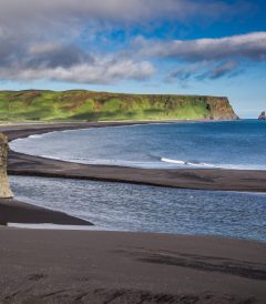 9-day self-drive tour around Iceland, big rock on the black beach.
