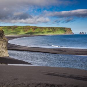 9-day self-drive tour around Iceland, big rock on the black beach.