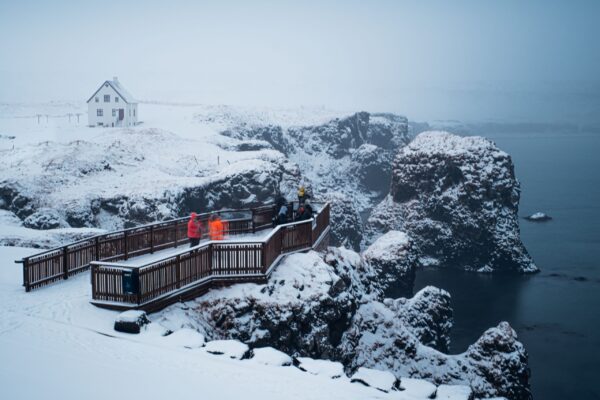 10-Day Winter Ring Road Tour Around Iceland, tourist platform close to the sea.